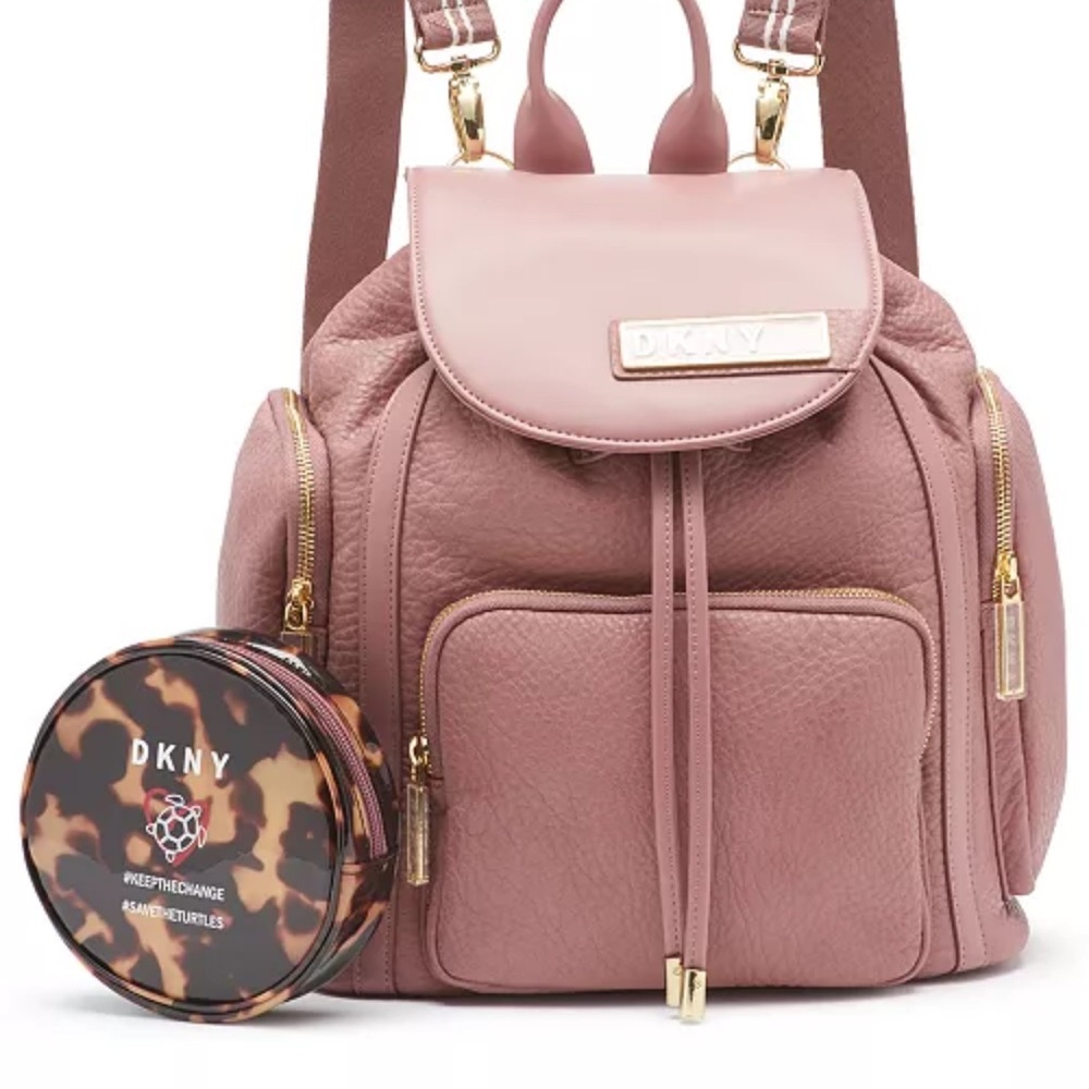 DKNY backpack. 3 year warranty. Drawstring and zipper closure. Only used once.